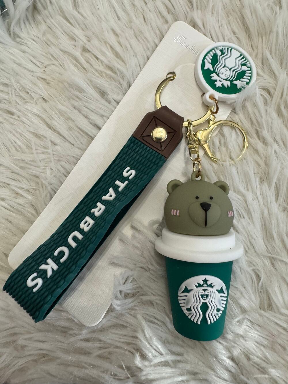 Starbucks bear on a green cup keychain with white logo strap